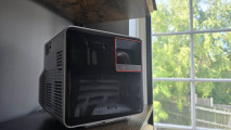 A front-on view of the Benq 300G gaming projector in front of a window