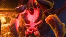 A Fellowship boss has an exposed lava core and is made of rock with glowing red eyes
