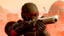 Helldivers 2 patrol changes: a soldier in black and red space armor, aiming a pistol with a massive barrel