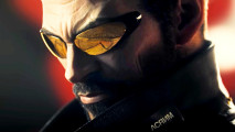 Deus Ex and Baldur's Gate lead Prime Gaming August free games lineup - Deus Ex Mankind Divided protagonist Adam Jensen, a bearded man wearing orange shades and a high-collared jacket..